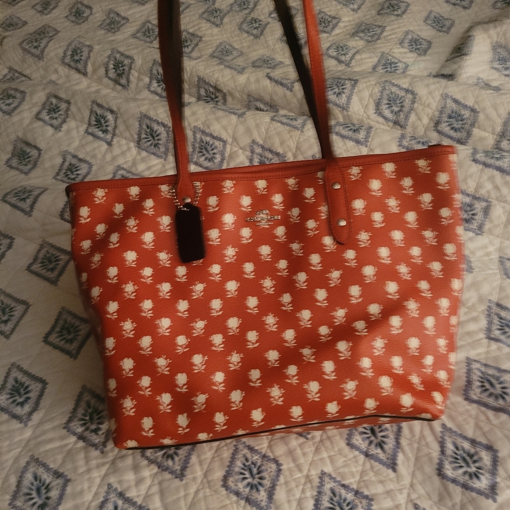 Coach Orange Bag with White Floral Design